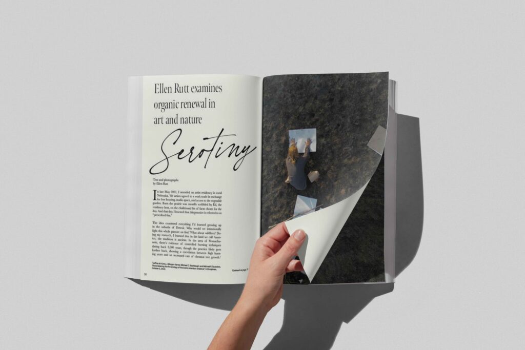 A hand turns a book page.