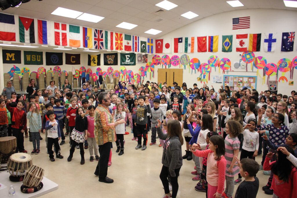 A school gymnasium packed with young students