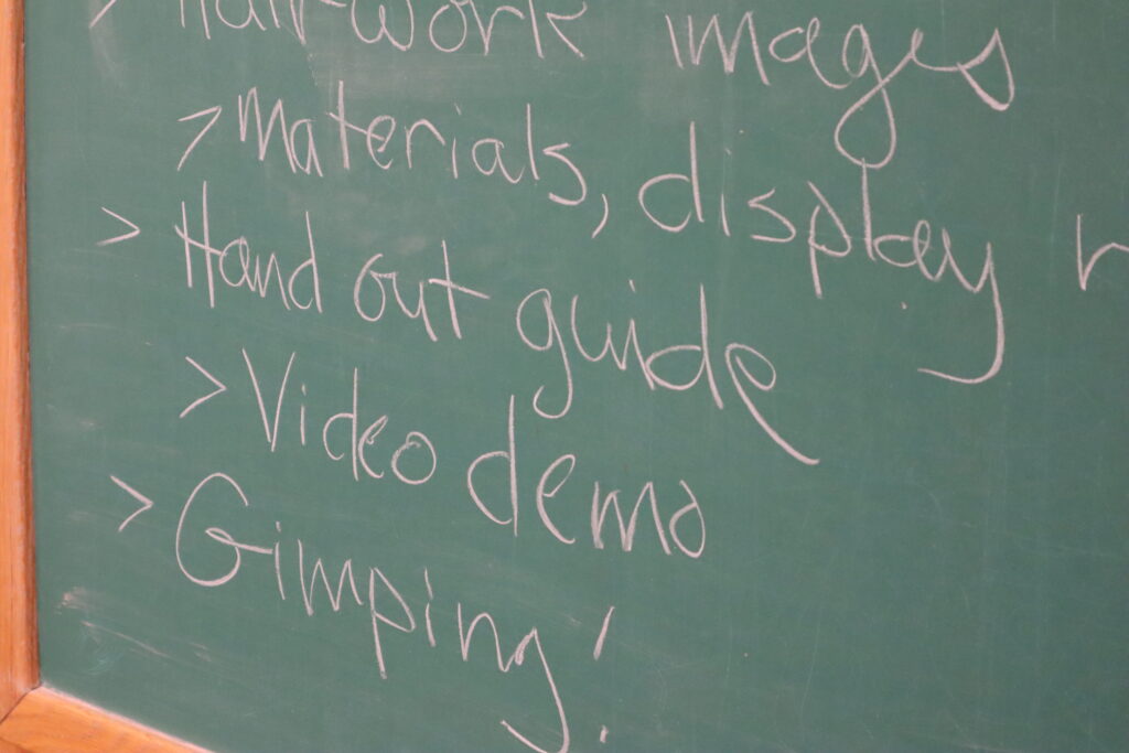 A green chalkboard with words written on it.