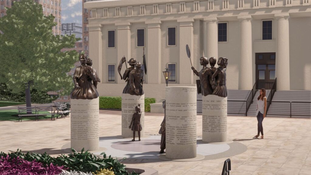 Digital rendering of the Ohio Women’s Monument from another angle, showing bronze statues of women holding protest signs and banners in front of the Ohio Statehouse.