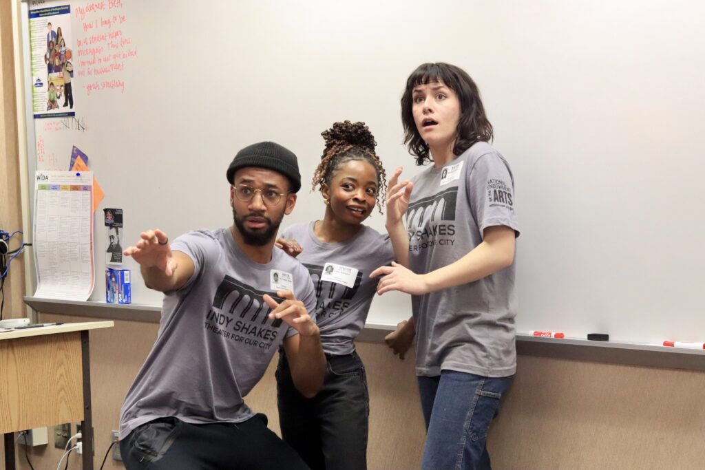 Three actors in a classroom