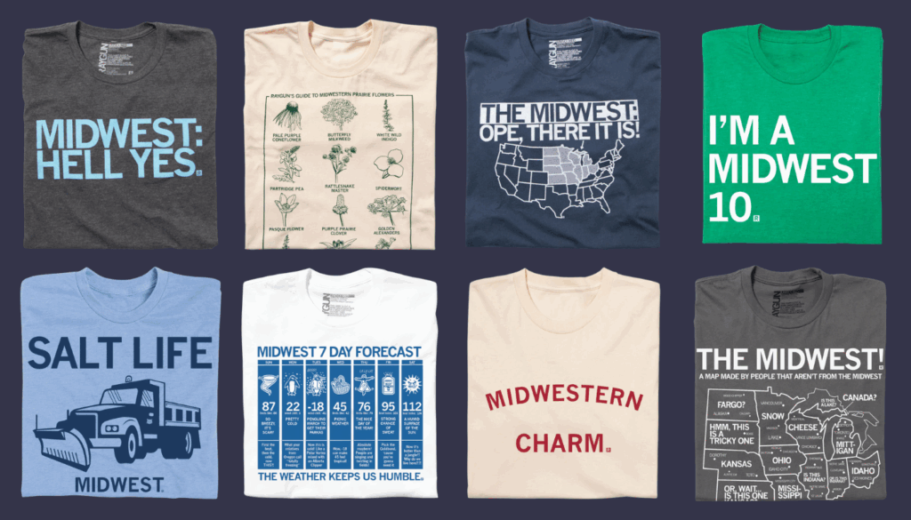 Eight T-shirts folded and displayed with Midwest-themed designs from the designer, Raygun. Phrases include "MIDWEST: HELL YES." and "MIDWESTERN CHARM." Illustrations depict maps and weather icons. S